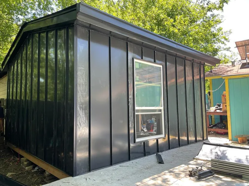 Black standing seam metal wall panels for Metal Roof Installation in Erie