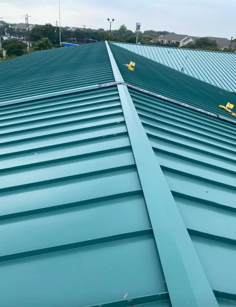 Green commercial metal roof ridge and valley for Metal Roof Repair in Erie